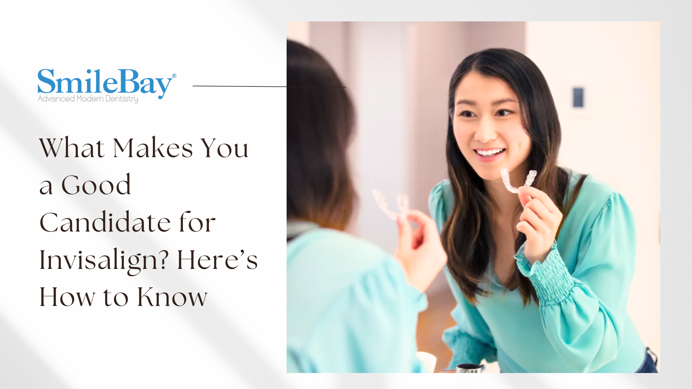 Woman smiling in the mirror while holding an Invisalign clear aligner, symbolizing suitability for treatment.