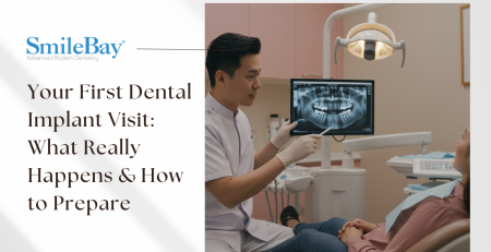 Dentist giving patient a consultation on dental implant