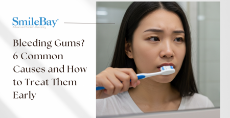 Girl looking at a mirror while brushing her teeth, looking concern